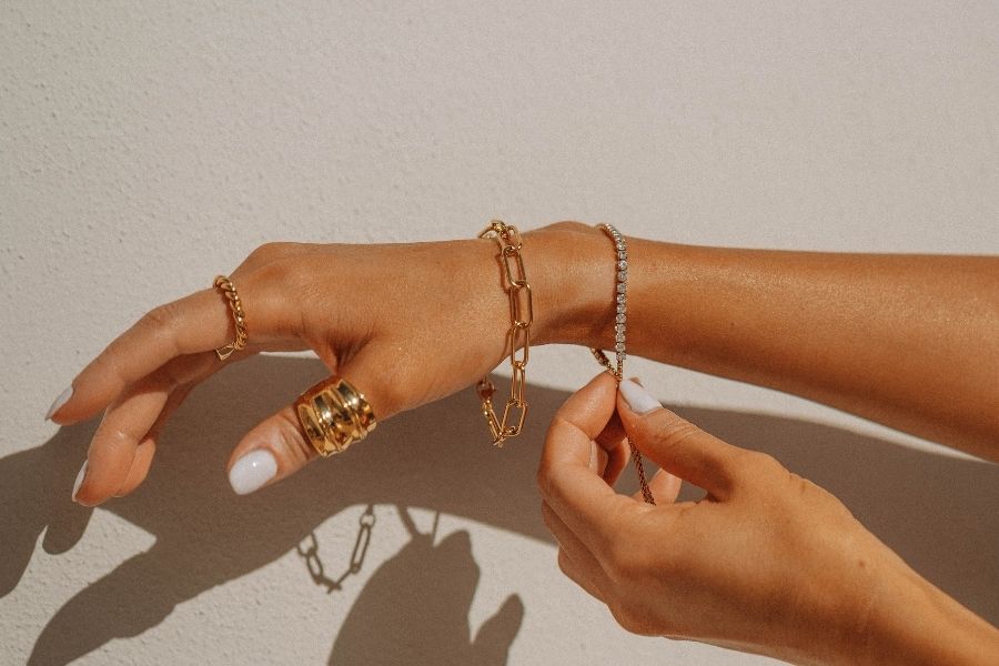woman hand with bracelets and rings
